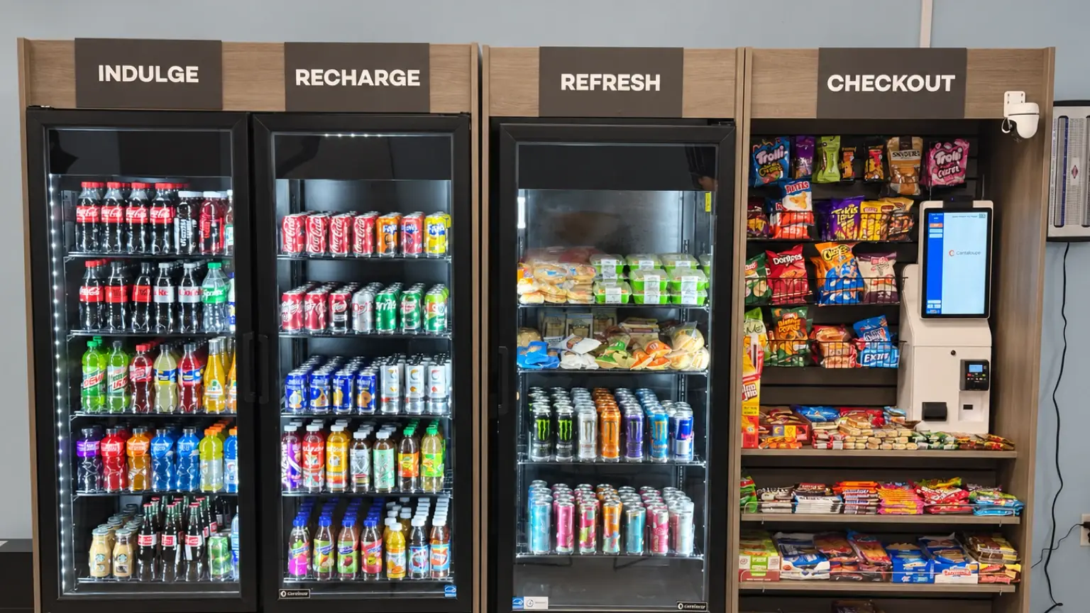 Micro market with snack, drink and checkout sections and a self-checkout kiosk