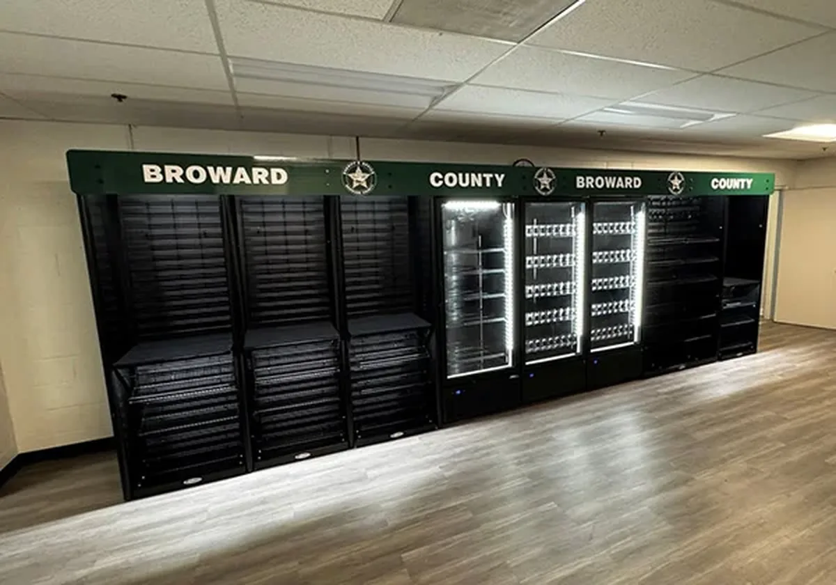 Micro market in a breakroom with coolers and a kiosk
