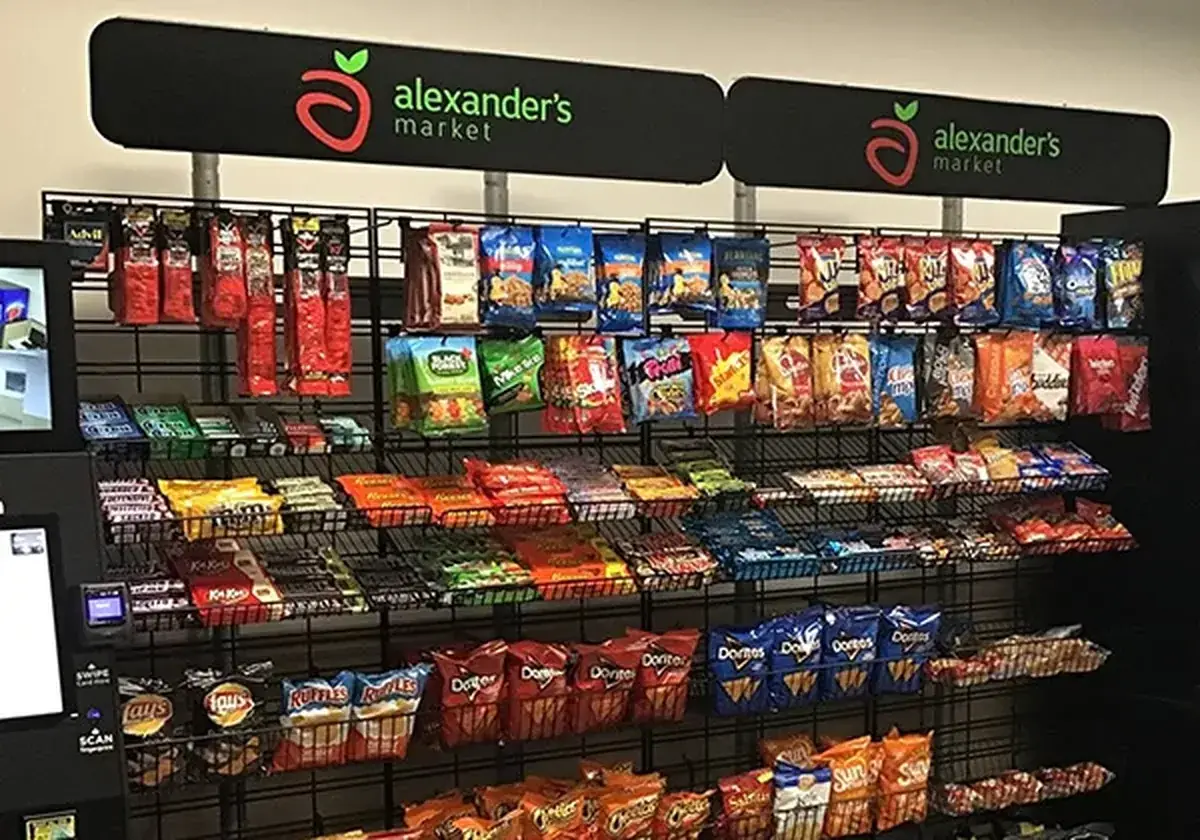 Micro market with branded header, coolers and snack racks