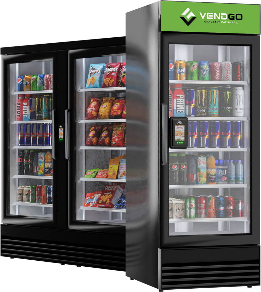 Two black Vendgo smart coolers side by side, stocked with drinks, chips and candy, featuring digital shelves and contactless payment screens in an Atlanta office micro market.