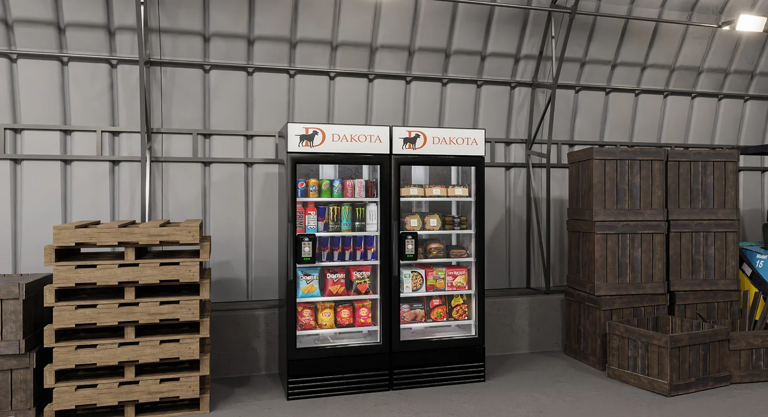 Dakota-branded beverage coolers in a warehouse stocked with drinks and snacks, representing Vendgo's smart cooler solutions for manufacturing facilities in Atlanta.