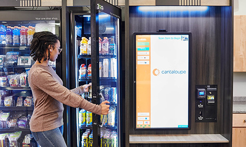 Employee using VendGO micro market vending machines with 24 7 access in Atlanta
